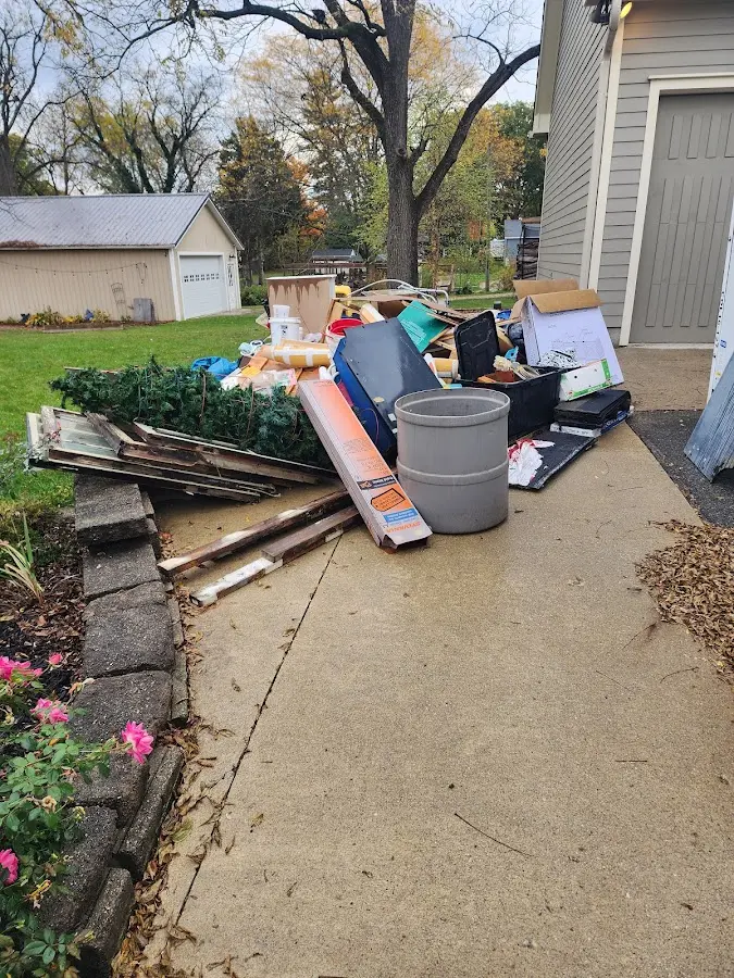 Dumpster being loaded with debris for Roofing Dumpster Rental in Shelton